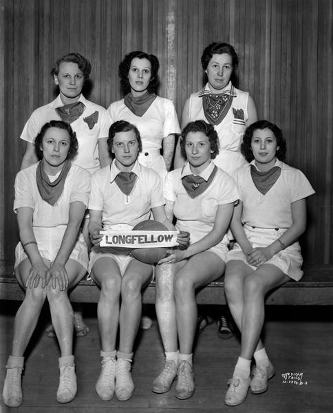 Group portrait of seven women in uniform on the Longfellow School volleyball team, Greenbush neighborhood.