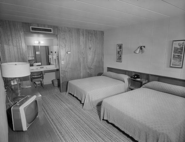 Typical guest room at the Holiday Inn Motel, 4402 East Washington Avenue, in Madison, with two double beds and a television.