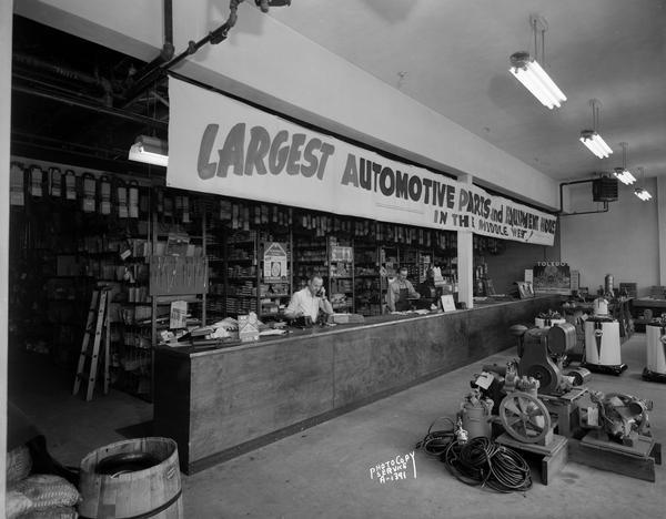 The parts department counter at Winnebago Auto Replacement Co., 103 North Park Street, which boasted it was the "Largest Automotive Parts and Equipment House in the Middle West!"