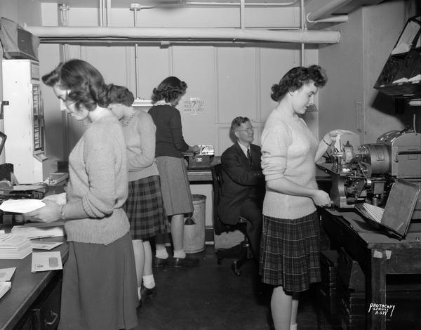 Four messenger girls and a man in the First National Bank mail room.