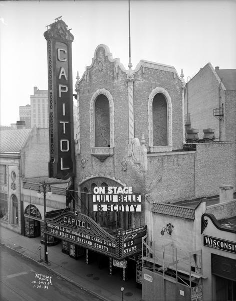 The Capitol Theatre marquee, 209 State Street, from the roof of Weber's. The marquee is promoting WLS National Barn Dance Stars, Lulu Belle & Scotty. The view also includes the Jack and Jill store.