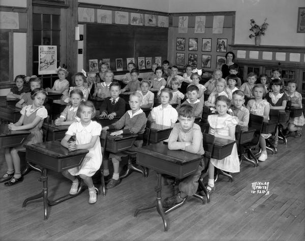 Second grade students sitting at desks in the second grade classroom at Dudgeon School, 3200 Monroe Street.