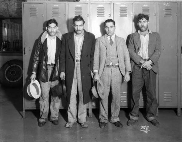 Portrait of four men, suspected Lone Rock bank robbers.
