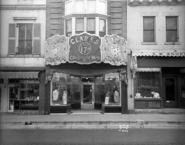 Clark's "Clothes for Men" clothing store, 126 State Street. Included in the view are Harry Blum's jewelry store, 128 State Street, and C.W. Anderson jewelers, 124 State Street.