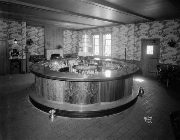 Circular bar at the Park Hotel, 22 S. Carroll Street, with fireplace and cigarette vending machine.