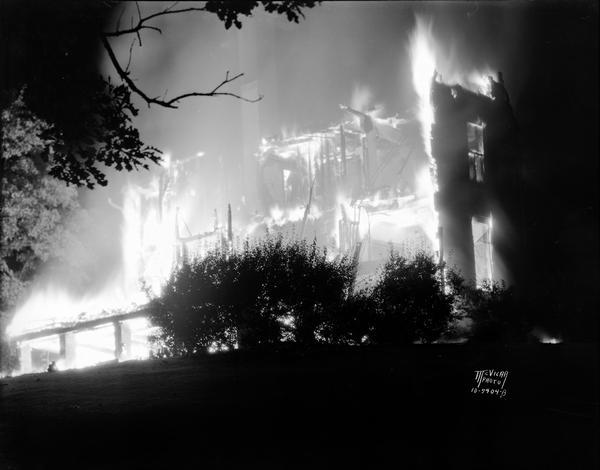 Edward J. Young Picnic Point house in flames.
