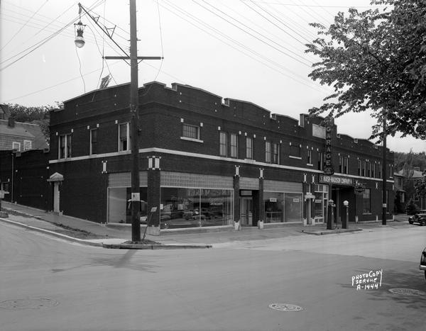Nash-Madison Automobile Dealership and Service Station, 2201 University Avenue, at Allen Street. The view includes two gas pumps located on the sidewalk near the curb.