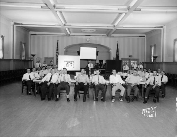 Group portrait of Wisconsin Power & Light Company salesmen attending a class in the VFW Hall, 113-115 East Mifflin Street.