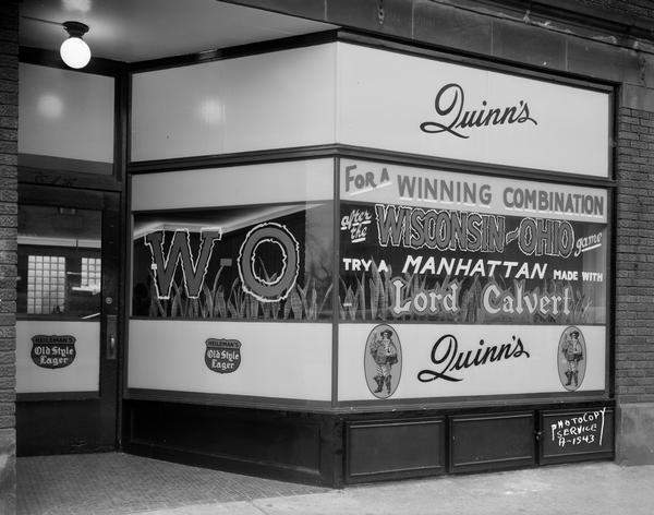 Quinn's Tavern, 614 University Avenue, entrance and Lord Calvert window.  "For a winning combination after the Wisconsin - Ohio game try a Manhattan made with Lord Calvert."