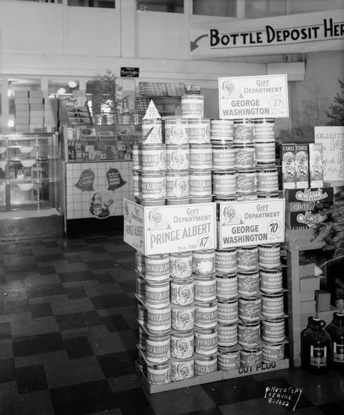 Piggly Wiggly store tobacco display with cans of Prince Albert and George Washington brands in cans.