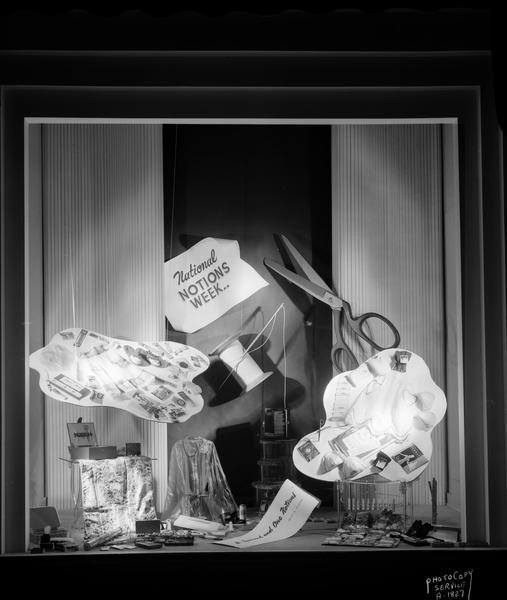 H.S. Manchester Inc., 2 East Mifflin Street, display window promoting "National Notion Week" and displaying items (notions) used for sewing.