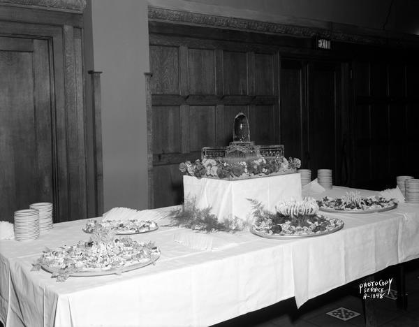 Buffet table for State Hotel Manager's convention, featuring ice carving of the State Capitol building. Taken in the Blue Room at Park Hotel, 22 South Carroll Street.