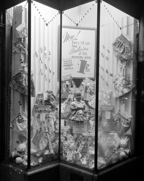 S.S. Kresge Store, 25-27 East Main Street, display window featuring Valentine's Day gift selections, with sign: "Now! Every Tot Can Have a Ballerina (skirt) at this Economy Price, $1.39, Sizes 3-6, Picques, Poplins, Chambray and Percale."