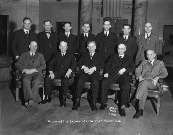 Group portrait of Wisconsin's twelve presidential electors, Democrats, in the Senate chamber, who unanimously voted for Franklin D. Roosevelt, president, and John N. Garner for vice-president.