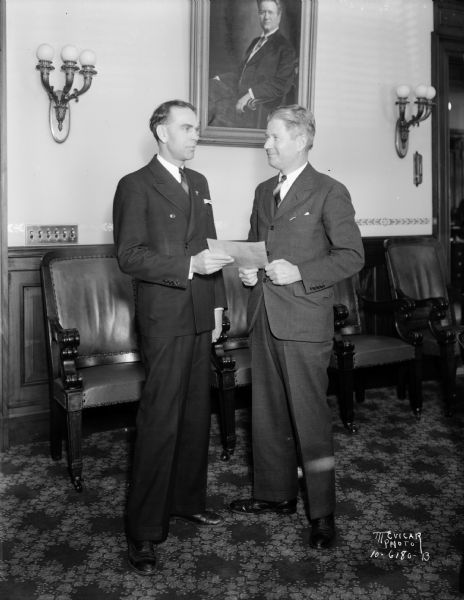 Governor Phil La Follette and Cyril Ballam, clerk for the State Public Service Commission.