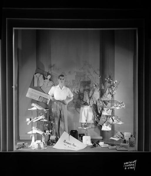 Manchester's, Inc., 2 East Mifflin Street, window display featuring Arrow shirts and men's clothing for Father's Day; includes a male mannequin.