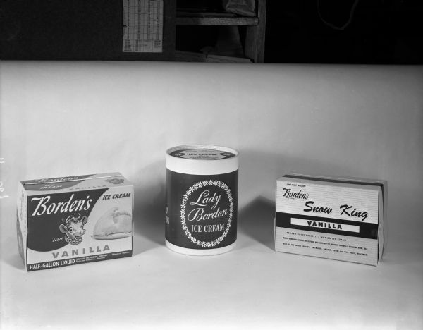 Three different cartons of Borden's dairy products: Vanilla Ice Cream with "Elsie the Cow" logo; "Lady Borden Ice Cream;" and Borden's "Snow King" frozen dairy dessert.