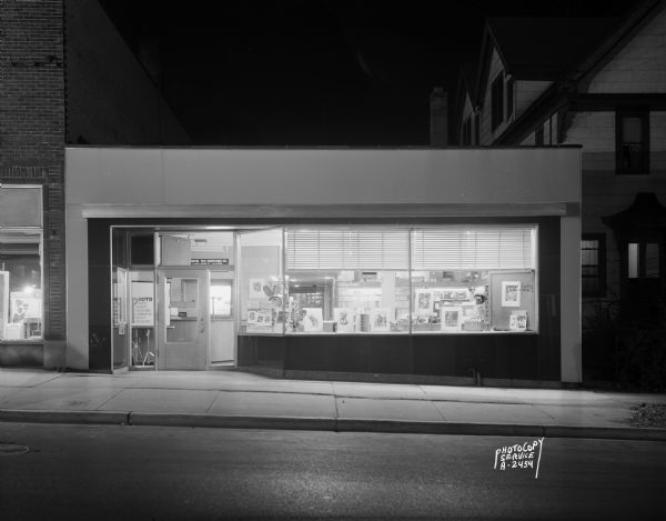 Exterior view from street at night of the Photo Copy Service and Madison Film Productions, Inc., building at 211 West Mifflin Street.