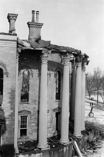 Elevated view of the damage to the East Wing of the third Wisconsin State Capitol caused by the fire of February 27-28. The statue of "Forward" can be seen at the right.