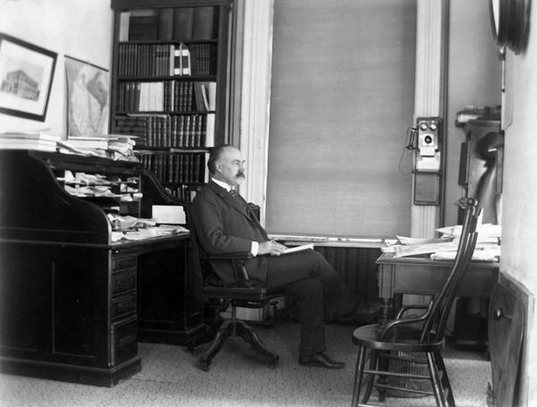 The office of Historical Society Librarian Isaac Bradley in the South Wing of the third Wisconsin State Capitol. Bradley, who joined the Society staff in 1875, succeeded Daniel Durrie as head librarian in 1892.