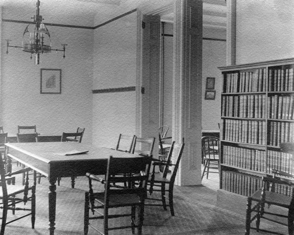 The north library reading room, which was reserved for women, in the Historical Society's quarters in the third Wisconsin State Capitol. This room, which was part of the South Wing constructed in 1883, illustrates much about the construction and appearance of that wing and probably, also, of the North Wing offices constructed for the Supreme Court and Law Library at the same time.