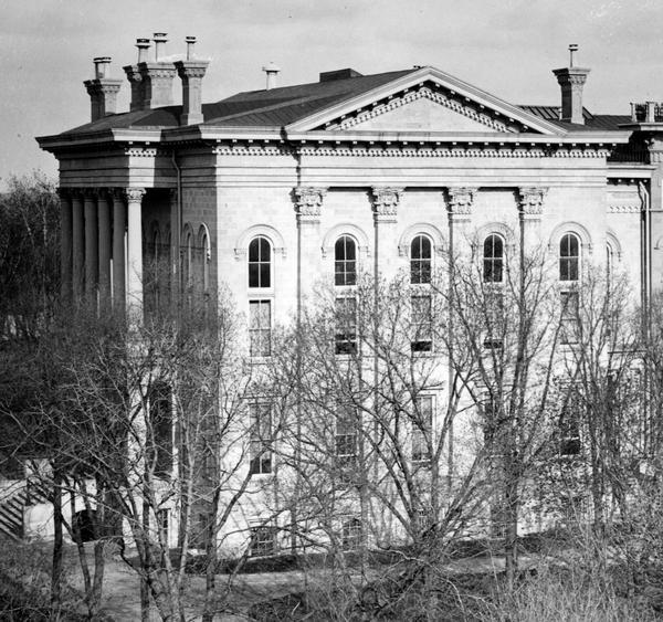 Detail of the photograph of the Third Capitol showing the North Wing addition completed in 1883. Designed by D.R. Jones, the North and South additions were more purely classical in design than the Kutzbock-Donnel design for the original structure, but the new wings nevertheless blended well. The north addition housed the Wisconsin Supreme Court. It was not damaged by the Capitol fire of 1904, and, as a result, it continued to be used during the construction of the new Capitol. The North Wing was demolished in 1913.