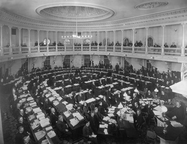 Elevated view of legislators in the Assembly Chamber of the Wisconsin State Capitol.