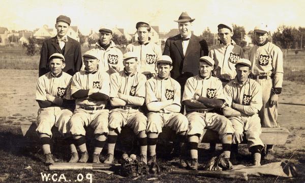 The Wisconsin Central Baseball Club, probably at Fond du Lac. Left to right the players are: Heinie Unferth, machinist's helper; A. Neuberger, boilermaker; C. Dyer, boilermaker; H. Devine, later a prominent physician; C. Bushaeger, machinist; E. Schautz, timekeeper; standing, an unknown umpire; J. Powers, manager; J. Crowley, machinist; and J. Linden, pipefitter.
