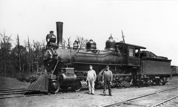 Minneapolis, St. Paul and Sault Ste. Marie railroad locomotive #2024, originally the Wisconsin Central Railroad #89, built by the Schenectady Locomotive Works about 1885. Engineer "Mel" Buck, holding the oil can, was the oldest engineer on the line when this picture was taken. He pulled passenger trains #11 and #12, which were once considered the fastest local trains in the Northwest.<p>Specifications: construction no. 2196, cylinders 17 x 24 inches, drivers 63 inches, boiler pressure 145 lbs.</p>