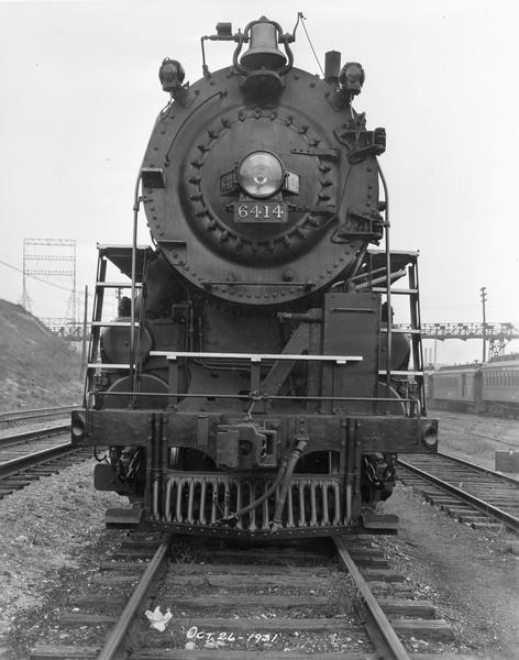 View of the front of the locomotive of Chicago, Milwaukee & St. Paul Railway, engine #6414, built by the Baldwin Locomotive Works in Philadelphia and purchased in 1931.