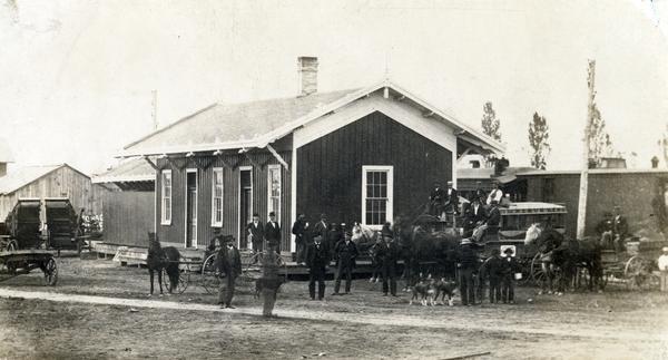 The Chicago & Northwestern Railroad depot. Included in the photograph is an omnibus operated by Major Throup.