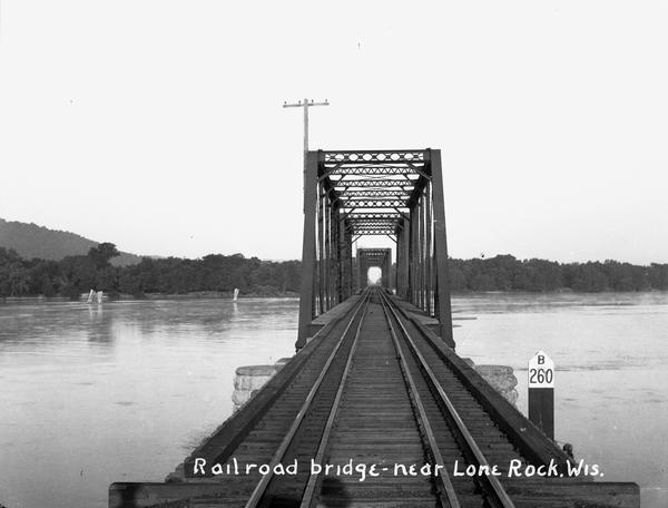 View down center of railroad bridge over the Wisconsin River near Lone Rock.