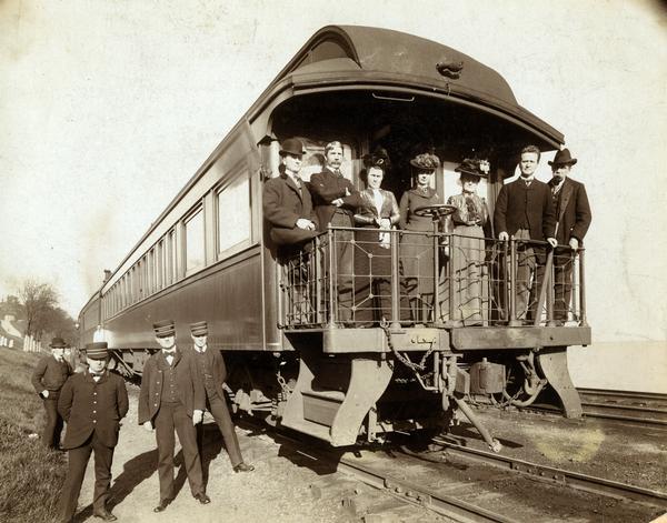 Robert M. La Follette, Sr. with a group on his special campaign train. From left to right they are Alfred T. Rogers, La Follette's law partner; Mr. and Mrs. John Strange; Lulu Daniels, a university friend of the La Follettes; Mrs. and Mr. La Follette; and Robert Howard of the "Milwaukee Sentinel." This photograph was taken near the end of a three week campaign that would culminate in La Follette's election as governor.