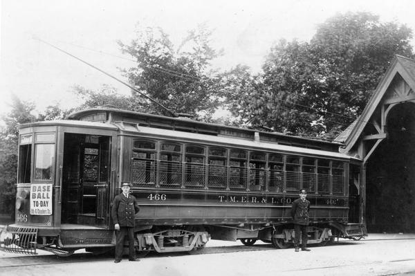 View of car #466, which was then one of Milwaukee's newest streetcars.  The car was put in service by TMERL about 1905 and was rebuilt as a duplex car in 1925, and finally scrapped in 1940. In 1906 the car ran on the Wells Street and Farwell Avenue line. This photograph was taken at the Lake Park terminal. On the front of the car is a broadside advertising a baseball game.