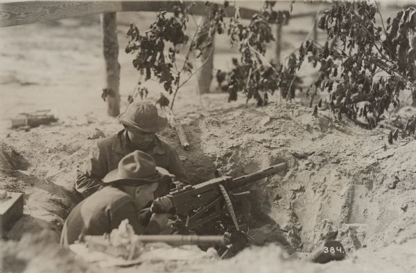 Although handwriting identifies this photograph as "Machine gun supporting tank attack," it is likely, since the print is also identified as having been taken by the Camp Meade photographer, that it depicts artillery training.