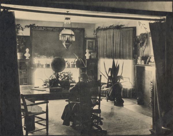A woman working in the library at Hillside Home school, an early progressive school operated by Ellen and Jane Lloyd Jones, aunts of Frank Lloyd Wright.