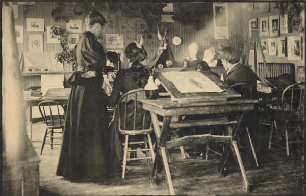 An art class being taught by a woman at Hillside Home School, an early progressive school operated by Ellen and Jane Lloyd Jones, aunts of Frank Lloyd Wright.
