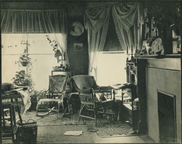 Interior shot of Aunt Nell's room at Hillside Home School, an early progressive school, operated by Ellen and Jane Lloyd Jones, aunts of Frank Lloyd Wright. A fireplace is on the right.