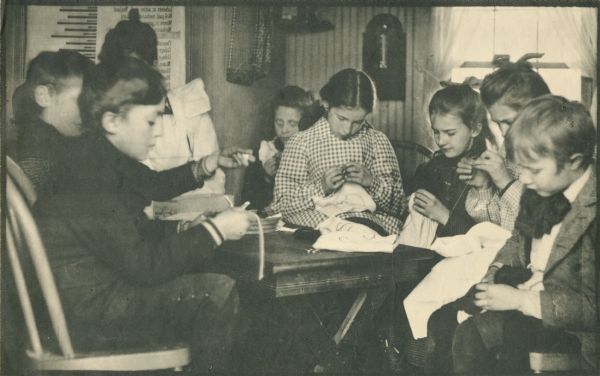 From a portfolio of collotype prints issued in 1900, a sewing class at Hillside Home School, an early progressive school operated by Ellen and Jane Lloyd Jones, aunts of Frank Lloyd Wright.