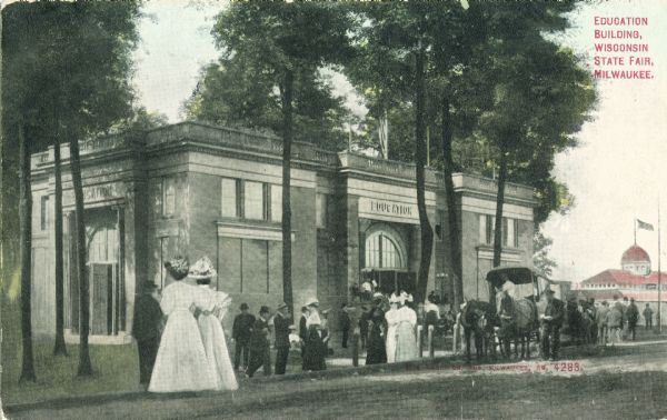 Crowd of people in front of the Education Building at the State Fair. Caption reads: "Education Building, Wisconsin State Fair, Milwaukee."