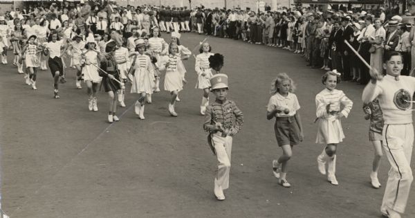 A parade of entrants in the baton twirling competition at the Wisconsin State Fair, in which only two boys can be seen.