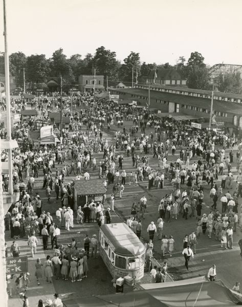 Elevated view of crowd outside the entrance to the Grandstand at the Wisconsin State Fair.