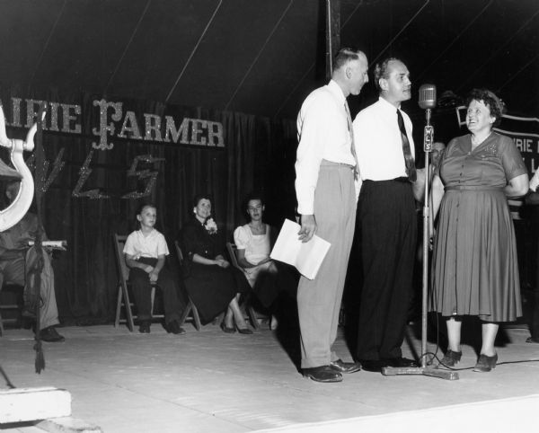 Governor Walter J. Kohler, Jr., speaking into the microphone on the WLS stage at the Wisconsin State Fair. At the time the Chicago station was best known for country music, especially the program Country Barndance.
