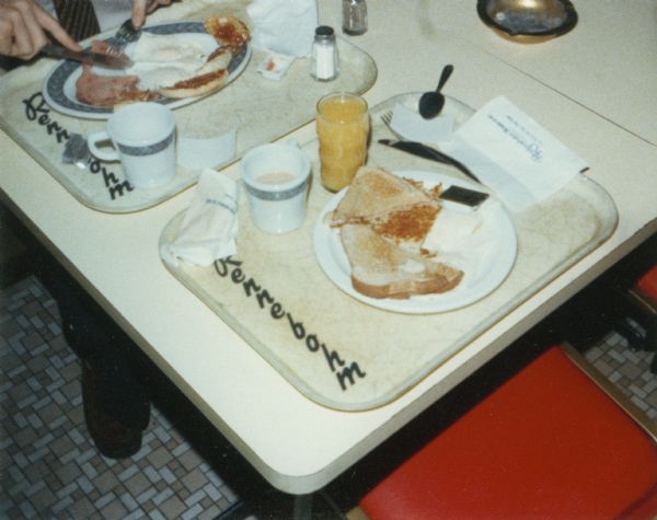 A snapshot of a partially eaten breakfast at an unidentified Rennebohm Drug Store cafeteria restaurant. The photograph was taken by Steven O. Kimbrough who was engaged in a personal project with friend Chuck Patch to eat breakfast and document every Rennebohms then in existence.