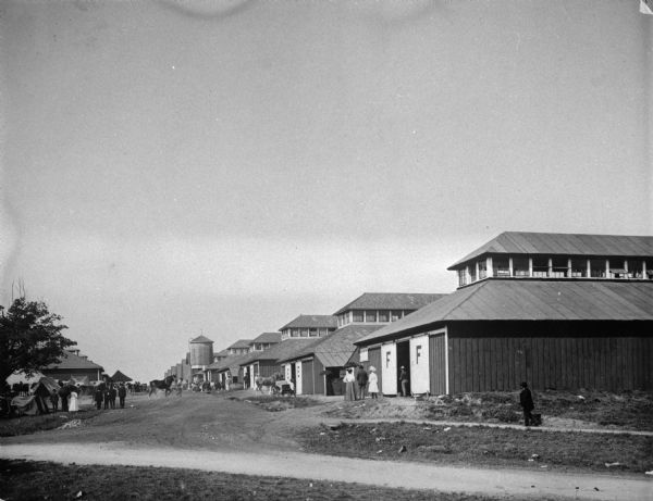 View of the Wisconsin State Fair showing the long row of horse barns.