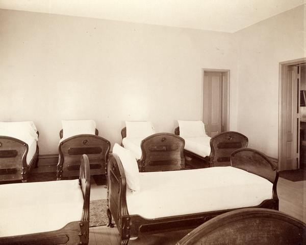 Six beds in the sleeping quarters of the Northern Hospital for the Insane.