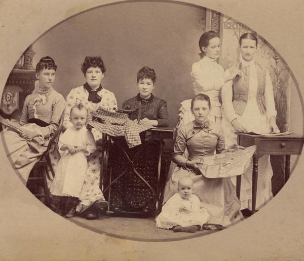 Alma(?), Wis. Studio portrait of group of women seamstresses and two young children.