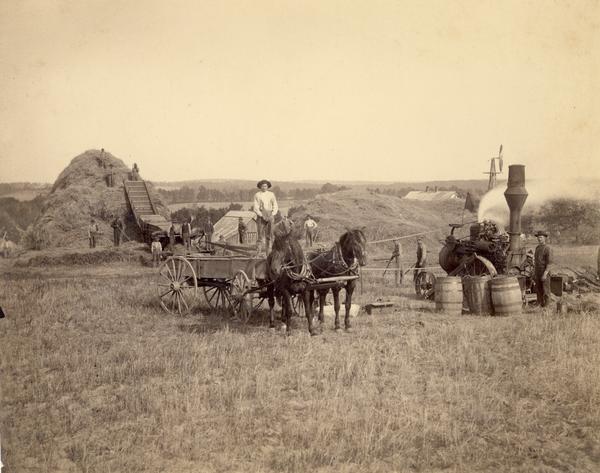 Wisconsin threshing crew, with steam operated tractor, in Buffalo county.