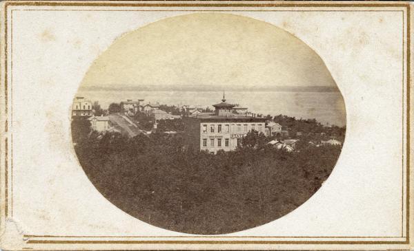 View of East Mifflin and North Pinckney Streets from the roof of the Wisconsin State Capitol building. This is the first block of East Mifflin Street. North Pinckney is in the upper left of the image. This view shows the mansions at the corner of Pinckney and Gilman Streets, and the Orsamus Cole house at the corner of Pinckney and Gorham Streets.