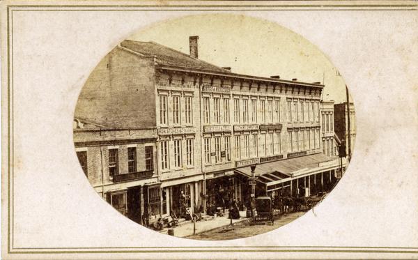 The first block of King Street and the three-story stone building at the corner of East Main and South Pinckney streets.